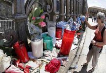 Flowers and candles for the memory