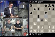 Karjakin y los cosmonautas con una imagen del seguimiento de la partida en un tablero